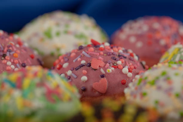 Colorful sweet chocolate small doughnuts with sprinkles . High quality photo