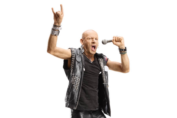 istock Male rock singer with a microphone gesturing a sign 1295774795