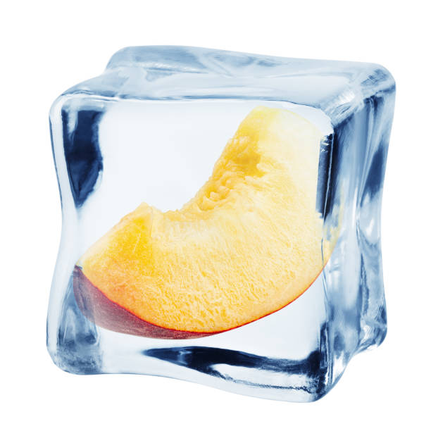 istock peach in ice cube, isolated on white background, clipping path, full depth of field 1295777120