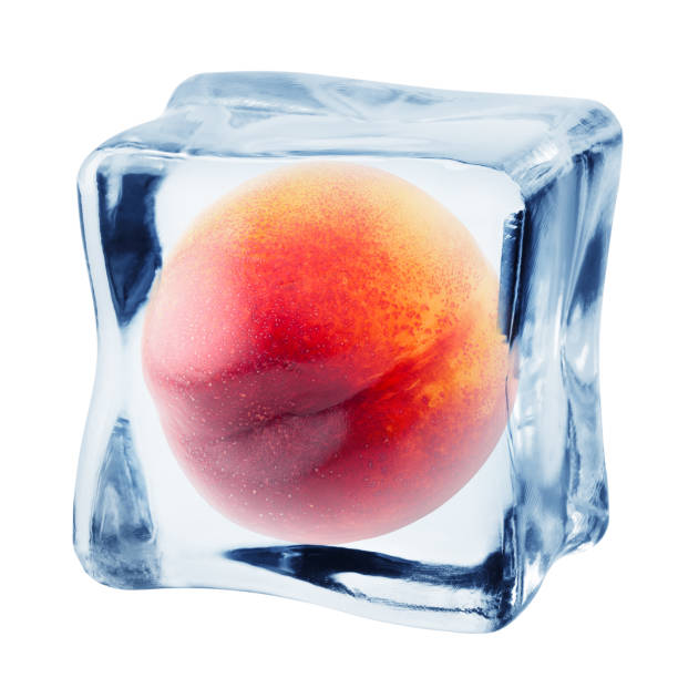 istock peach in ice cube, isolated on white background, clipping path, full depth of field 1295777122