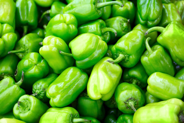 istock Fresh green bell paprika pepper as a background 1295778533