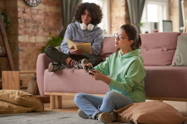 istock Friends sitting at home 1295778556