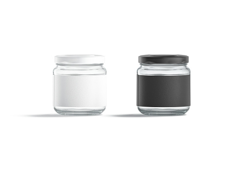 Blank small glass jar with black and white label mockup set, 3d rendering. Empty transparent closed can for food storage mock up, isolated, front view. Clear tin with sticker for logotype template.