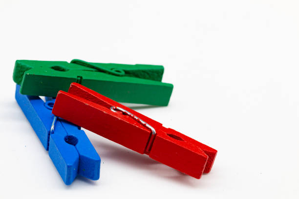 istock colored pegs on a white background, clothes pegs, clothespin 1295779152