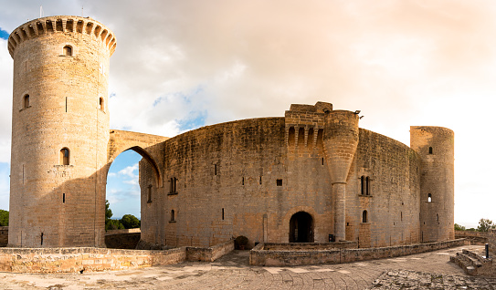 Palma de Mallorca, Spain - December 12, 2020: Bellver castle with a circular plan with a defense tower and a moat on the island of Mallorca, Spain