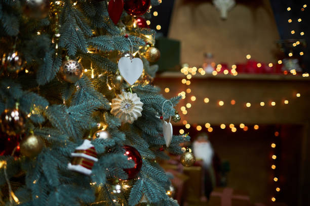 istock green Christmas tree decorated with sparkling balls and cones 1295779465