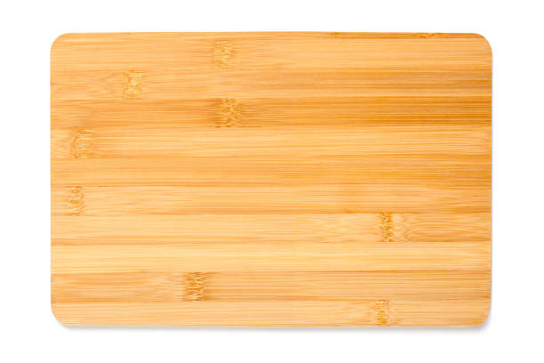 istock New rectangular wooden bamboo cutting board isolated on white background. Top view. Mock up for food project. 1295781644