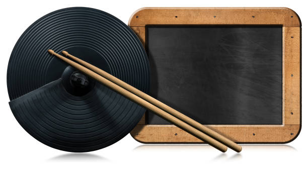 istock Cymbal of an Electronic Drum Kit with Drumsticks and Empty Blackboard 1295781700