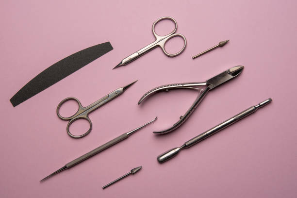 istock Set of manicure tools and accessories on a pink background. Hardware manicure,Flat lay. 1295783257