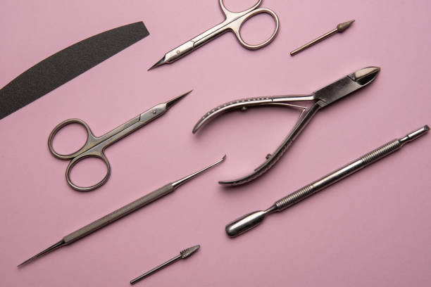 istock Set of manicure tools and accessories on a pink background. Hardware manicure,Flat lay. 1295783278