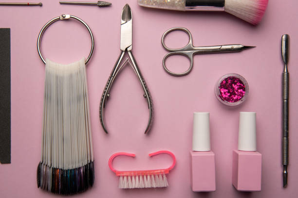 istock Set of manicure tools and accessories on a pink background. Hardware manicure,Flat lay. 1295783323