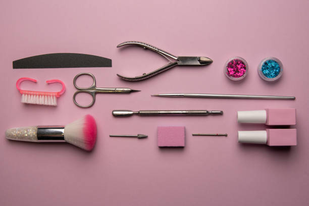 istock Set of manicure tools and accessories on a pink background. Hardware manicure,Flat lay. 1295783342