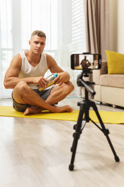 istock Fitness blogger streaming or recording video for his subscribers 1295785849