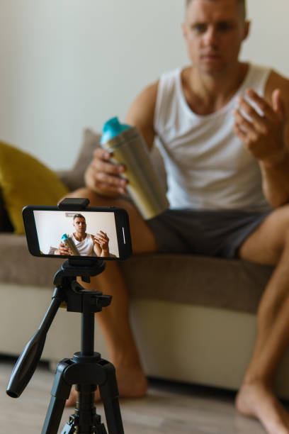 istock Fitness blogger streaming or recording video for his subscribers 1295785891