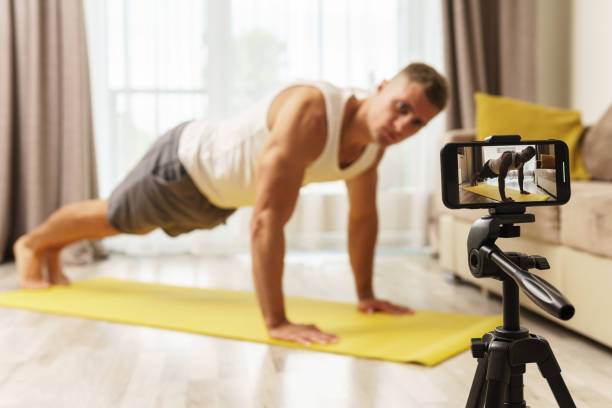 istock Fitness blogger streaming or recording video for his subscribers 1295785914