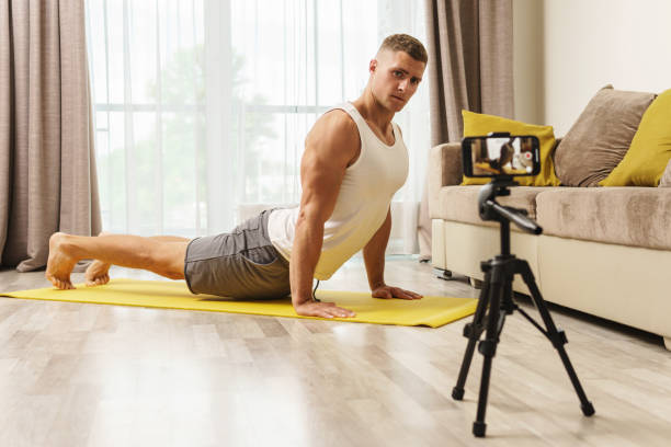 istock Fitness blogger streaming or recording video for his subscribers 1295785979
