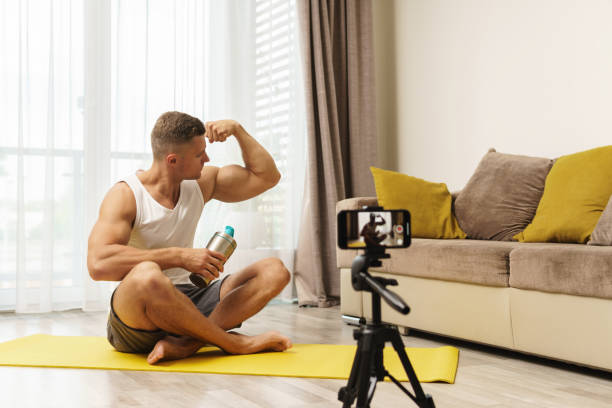 istock Fitness blogger streaming or recording video for his subscribers 1295785987