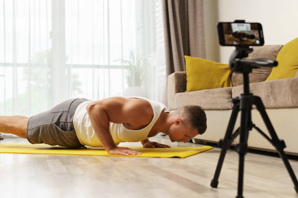 istock Fitness blogger streaming or recording video for his subscribers 1295786006