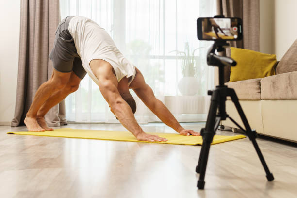istock Fitness blogger streaming or recording video for his subscribers 1295786048