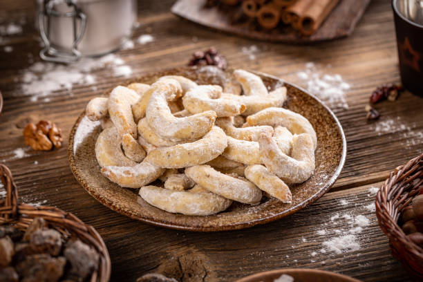 Crescent shaped Christmas cookies Crescent shaped Christmas cookies with wallnut and icing sugar walnut cookies stock pictures, royalty-free photos & images