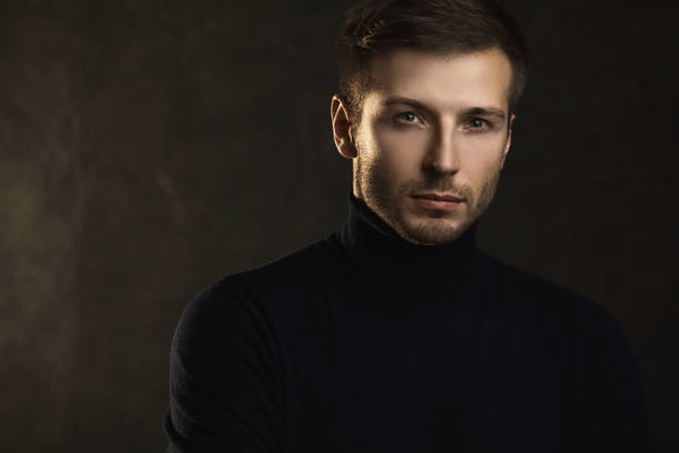 istock Young handsome man wearing a polo neck 1295787443