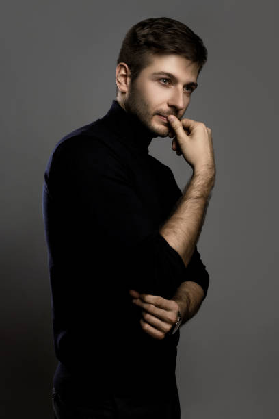 istock Young handsome man wearing a polo neck 1295787631