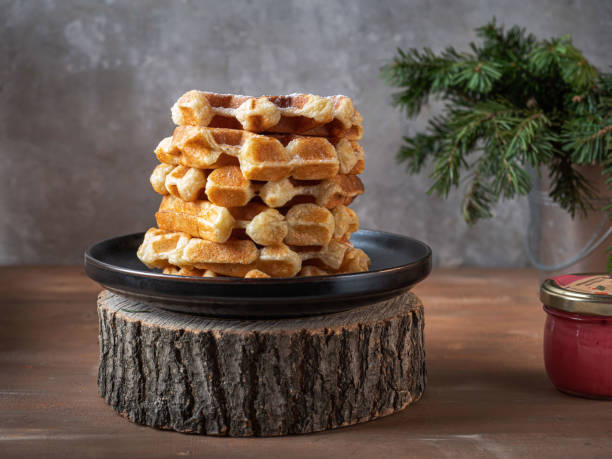 istock Homemade waffles with powdered sugar stacked in a mountain 1295787907