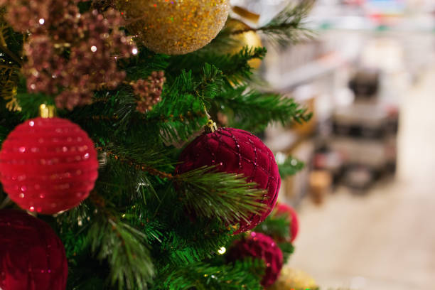istock Christmas tree with balls in the shopping mall, store 1295787968