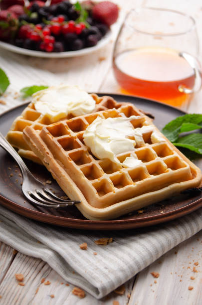 istock Belgian waffles served with butter and honey 1295789049