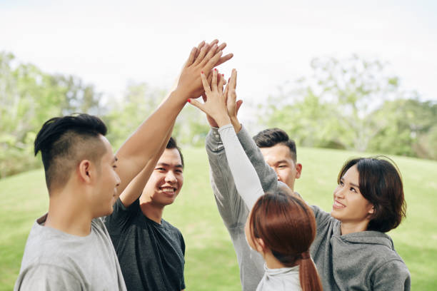 istock Sporty people giving each other high five 1295790484