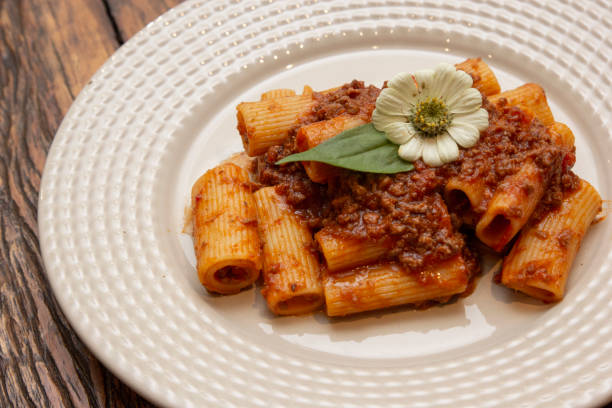 Rigatoni pasta with lamb sauce and ragout. stock photo