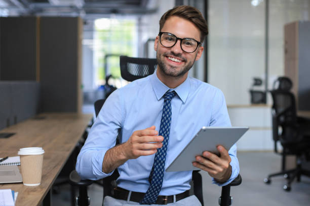 istock Young businessman using his tablet in the office. 1295791521