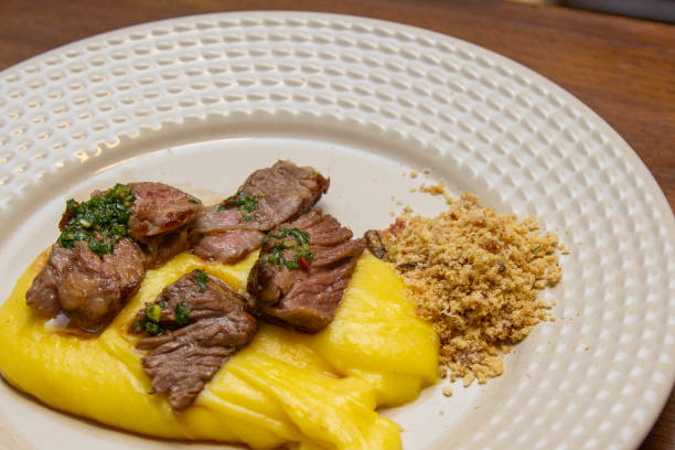istock Ancho steak with mashed and crispy manioc flour. 1295791918