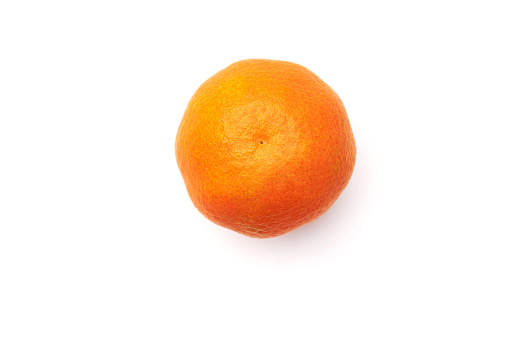 A mandarine or clementine photographed from above on a white background as a cut-out in the studio, high-resolution and format-filling