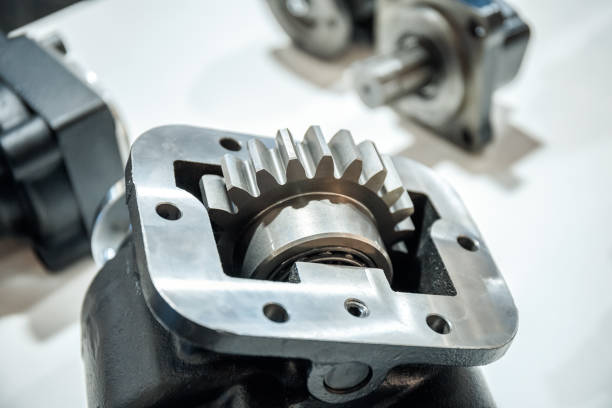 istock Mechanical spare parts for car engines on a light background. 1295794903