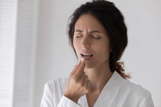 istock Unwell young woman take pill feeling sick 1295795486