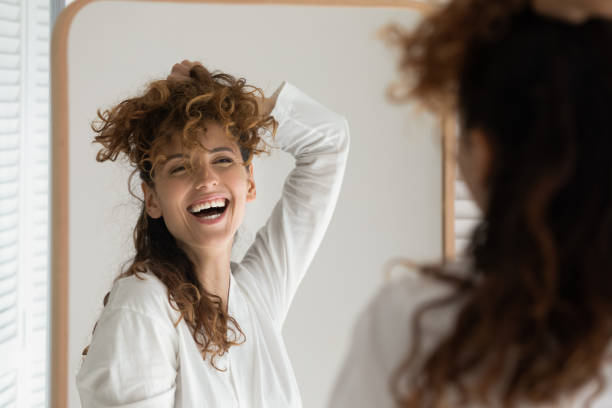 istock Smiling woman experiment with hairstyle in bath 1295795501
