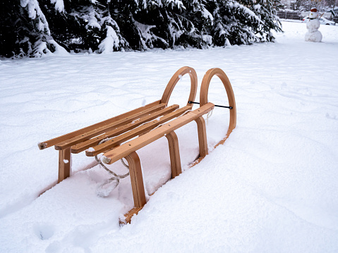 Wooden sledge in a wintry landscape on the mountain