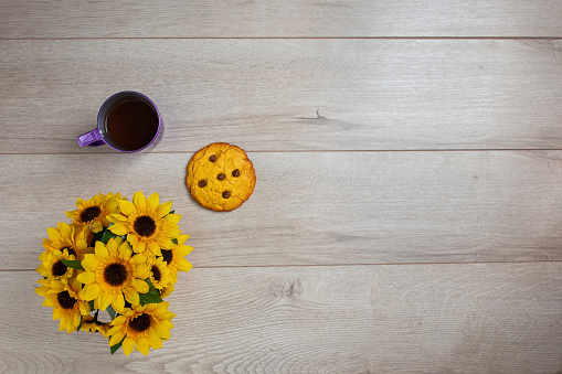 Creative concept of chocolate cookie on wooden and coffee cup, on wooden background. Top view, flat lay.