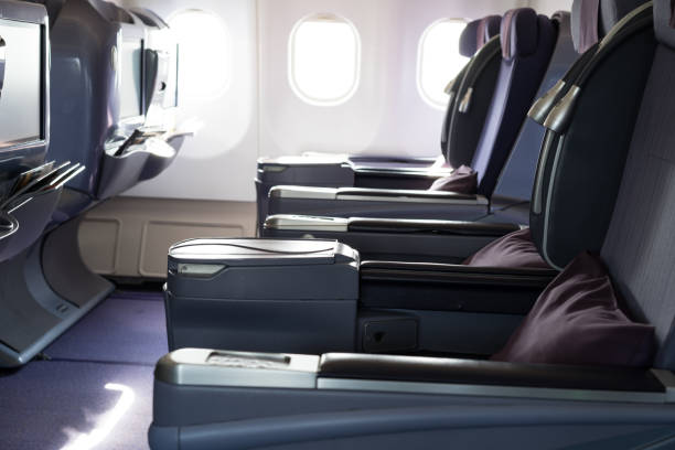 istock Airplane seat beside window in plane 1295800231
