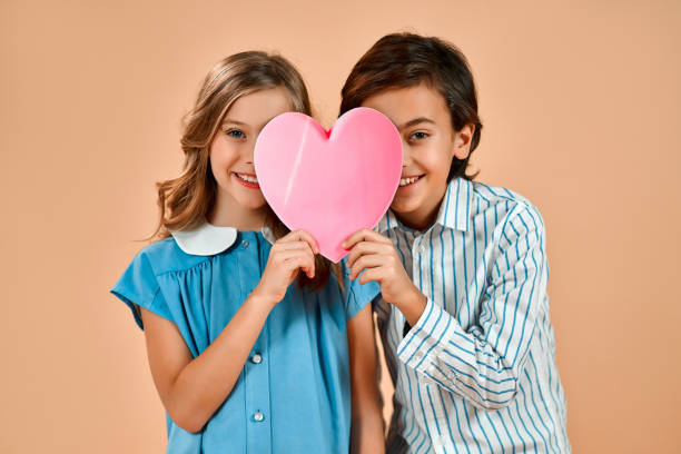 Woman and man holding a red heart Couple