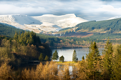 Snow-covered Pen-y-fan in the Brecon Beacons reflected in the Pontsticill and Pentwyn Reservoirs