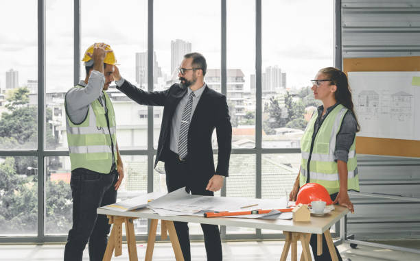 istock Engineers team meeting for architectural project. architects discussing blueprint with construction manager in office worker conference site. Construction Concept 1295804407