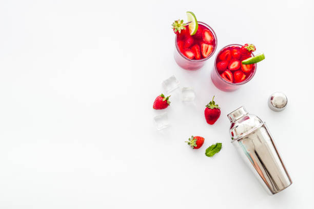 istock Strawberry mojito with ingredients and bar utensils. Top view 1295805681