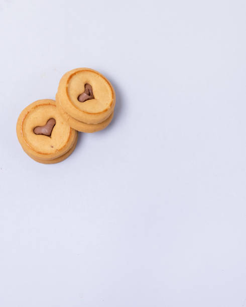 istock Homemade Cookies with Heart Shape Chocolate Window on Blue Background Copy Space 1295806555
