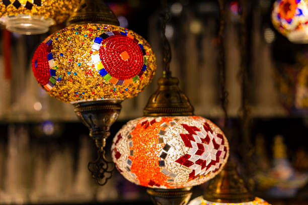 istock Traditional handmade multicolor Turkish, Moroccan, Arabian lamps hanging with nice blurred background. Mosaic style and colored glass lantern. Suitable for Ramadan Kareem greeting. 1295806571