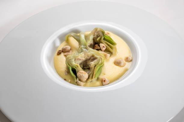 Artichokes on fontina fondue with hazelnuts \