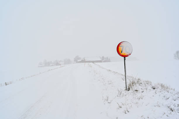 istock speed sign with 70 kph covered in snow 1295808806
