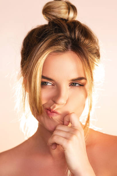 istock Young and pretty woman with a natural makeup 1295810838