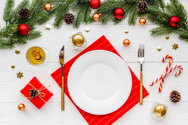 istock Christmas card or menu template copy space. Holiday table setting flat lay 1295813645